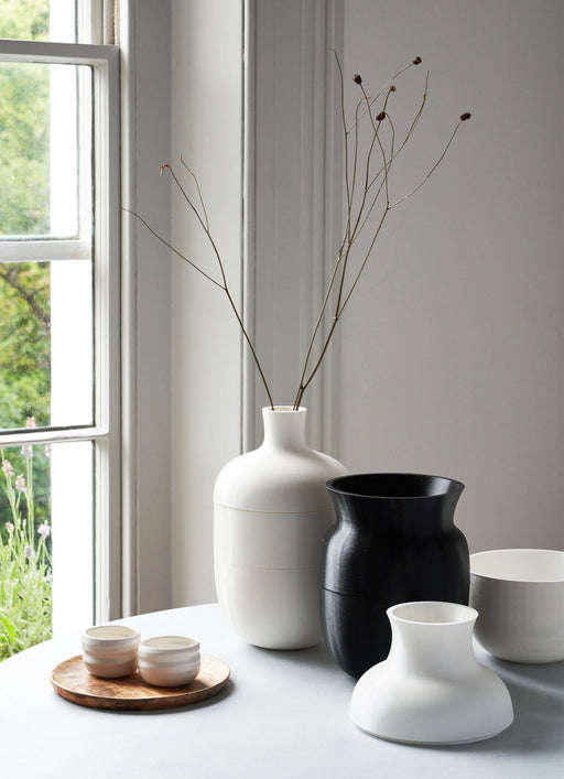 the alp vase 505 is made of recycled plastic using 3D printing. the 5 parts of the vase can be placed in different configurations to create 6 different vases to suit all your flower arrangements. the monochrome colours in black and white can be mixed